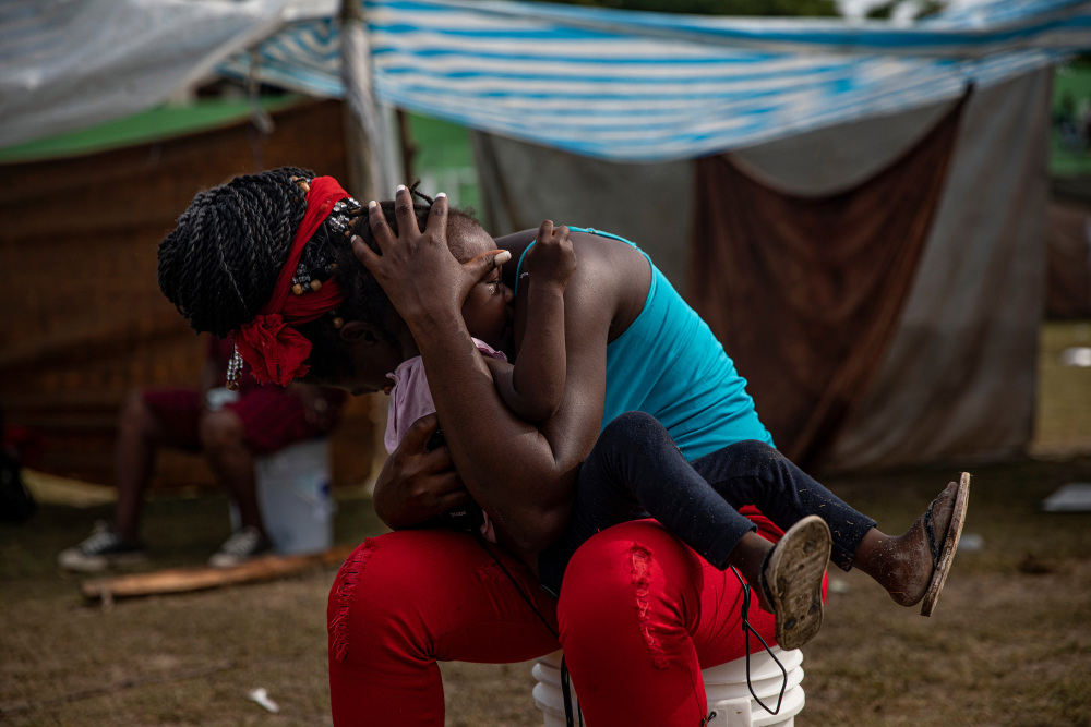 People displaced by the earthquake now living at a makeshift tent camp in Les Cayes, Haiti, Aug. 19.