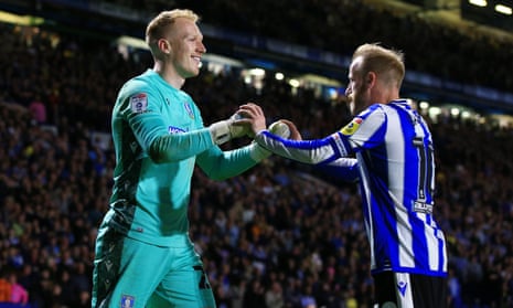 Sheffield Wednesday goalkeeper Cameron Dawson and his captain Barry Bannan celebrate after their side’s astonishing semi-final comeback against Peterborough United.