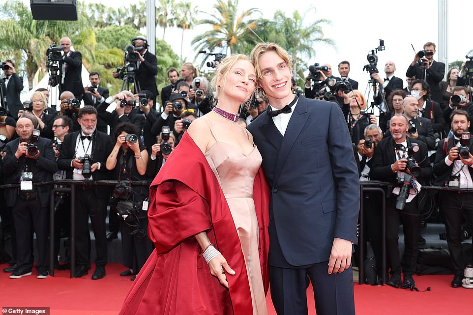 Family affair: The Kill Bill icon, 53, led the arrivals on one of the world's most prestigious red carpets, alongside her son Levon Hawke, who she shares with her ex-husband Ethan Hawke