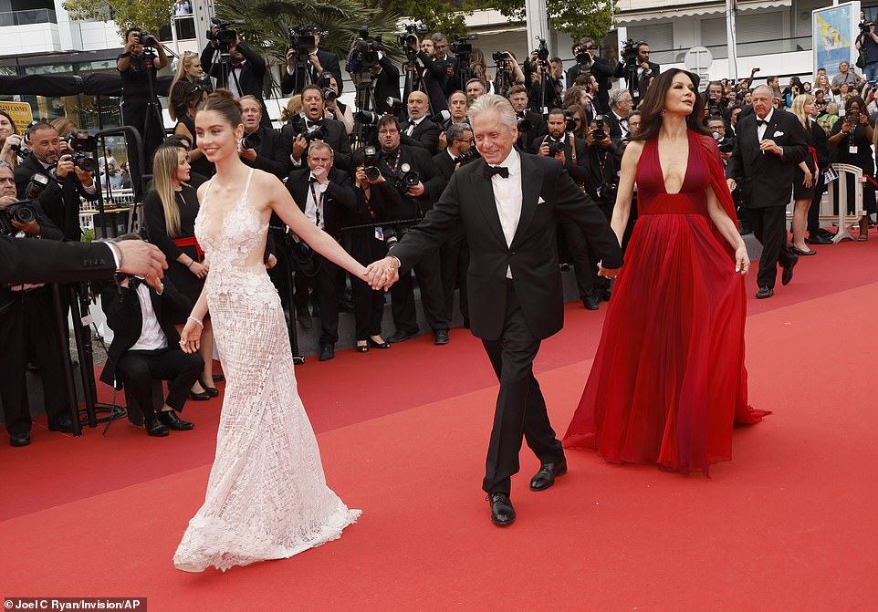 Support: Michael Douglas, who was to receive an honorary Palme d'Or at the opening night ceremony, walked the carpet with his wife, Catherine Zeta-Jones and their daughter, Carys Zeta Douglas