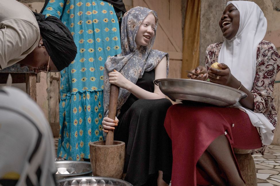 Penda Fall, a teenager with albinism, helps her family with chores in Dakar, Senegal - Tuesday 13 June 2023
