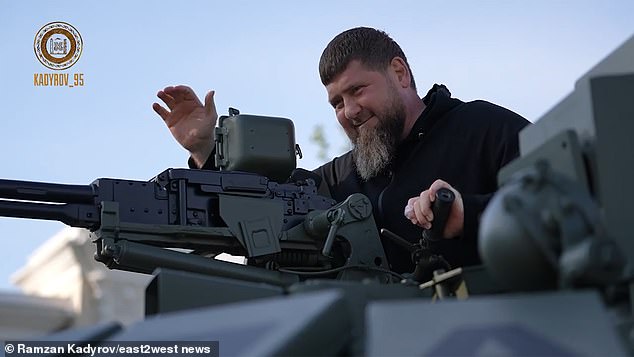 In-fighting between Russia's military and Putin's warlords is now at fever pitch. Pictured: Ramzan Kadyrov, leader of Chechnya, rides in a modernised T-72 tank