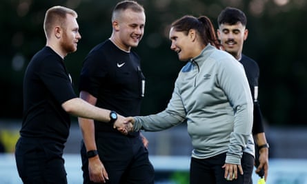 Forest Green’s interim manager Hannah Dingley shakes hands with match officials.