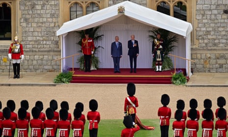 US president Joe Biden and King Charles listen to the US national anthem played by the Band of the Welsh Guards at Windsor Castle.