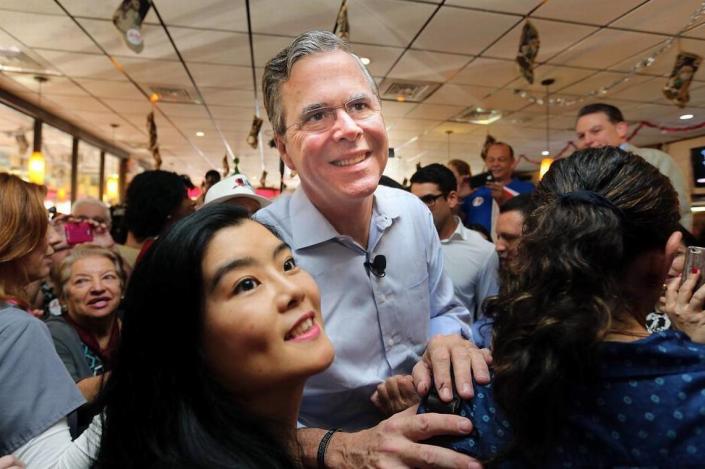 Presidential candidate Jeb Bush smiles for selfies with supportets at Chico&#x002019;s Cuban Restaurant in Hialeah on Monday Dec. 28, 2015 on his first leg of many campaign stops in Florida.
