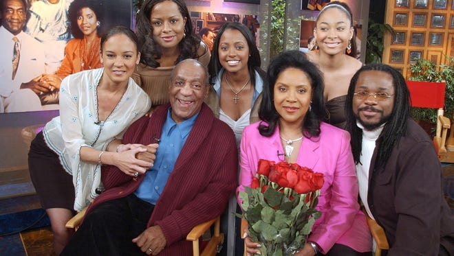 FILE – In this May 2, 2002, file photo, actors who portrayed Bill Cosby's fictional television family, the Huxtables, on the situation comedy "The Cosby Show" pose together in NBC's "Today" show studio in New York. From left are Sabrina Le Beauf, Tempestt Bledsoe, Cosby, Keshia Knight Pulliam, Phylicia Rashad, Raven-Symone and Malcolm-Jamal Warner. Cosby's retrial on sexual assault charges is set to begin Monday, April 9, 2018. (AP Photo/Richard Drew, File) ORG XMIT: PAPX403