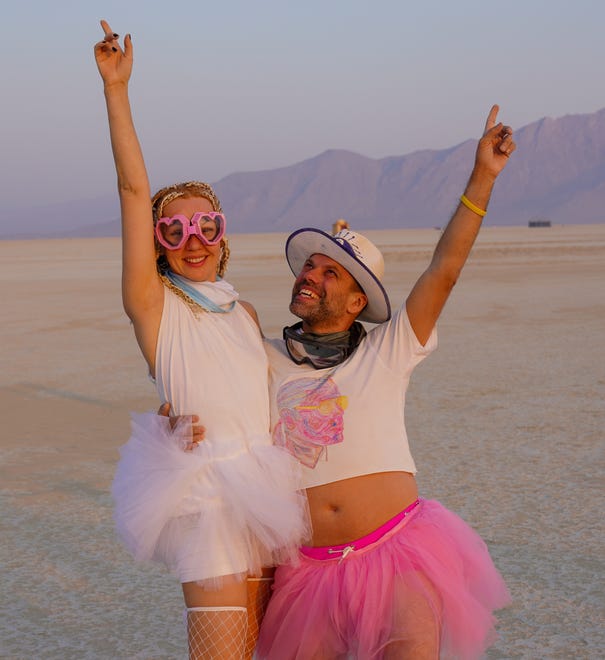 Olga Denisova and Eugene Vasilenko of California pose for a photo at Burning Man.