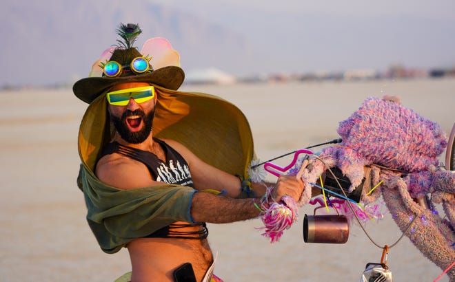 Burning Man participant "Jungle" of Guatemala poses for a picture at the event.