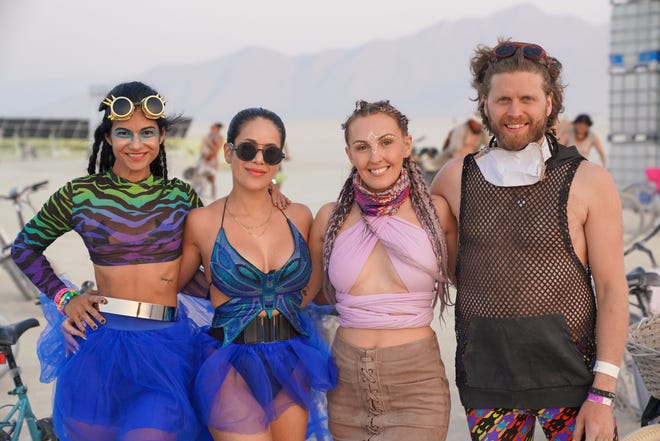 Fabiola Sanchez of Houston, Carla from New York, and Kris Elsley and Dan McCann of Toronto pose for a photo at Burning Man.
