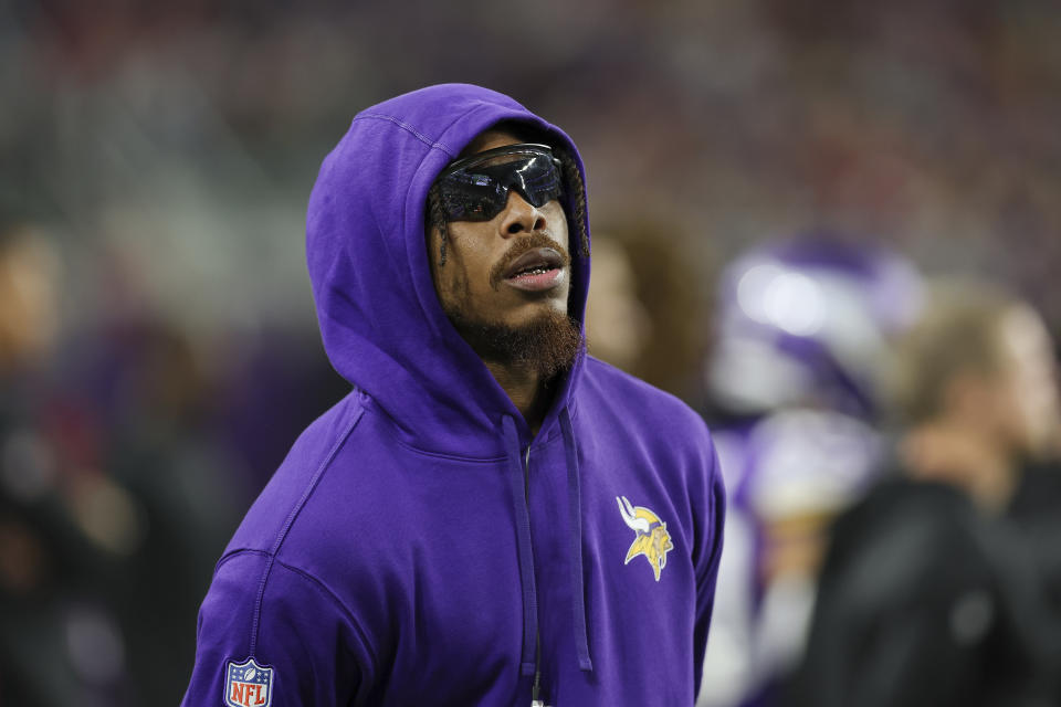 Minnesota Vikings wide receiver Justin Jefferson watches action from the sideline during the first half of an NFL football game against the San Francisco 49ers, Monday, Oct. 23, 2023 in Minneapolis. (AP Photo/Stacy Bengs)