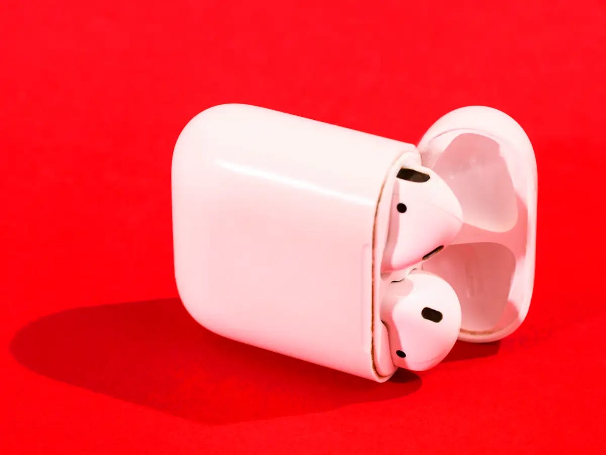 Apple Airpods on a Red background