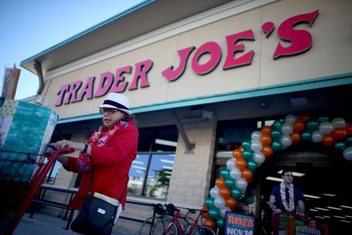 National Labor Relations Board officials say Trader Joe's threatened to take away workers' raises if they unionized.