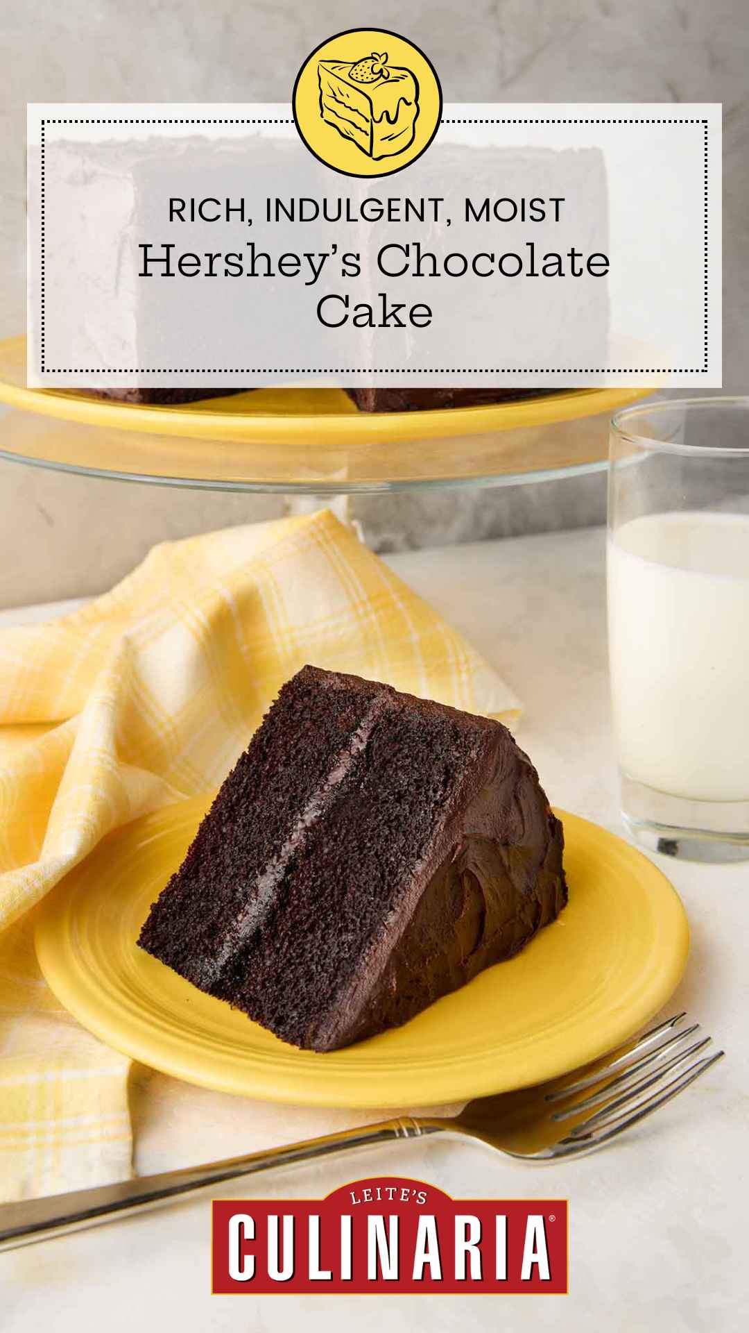 A slice of Hershey's chocolate cake with chocolate frosting on a yellow plate, with the remaining cake on a stand in the background.