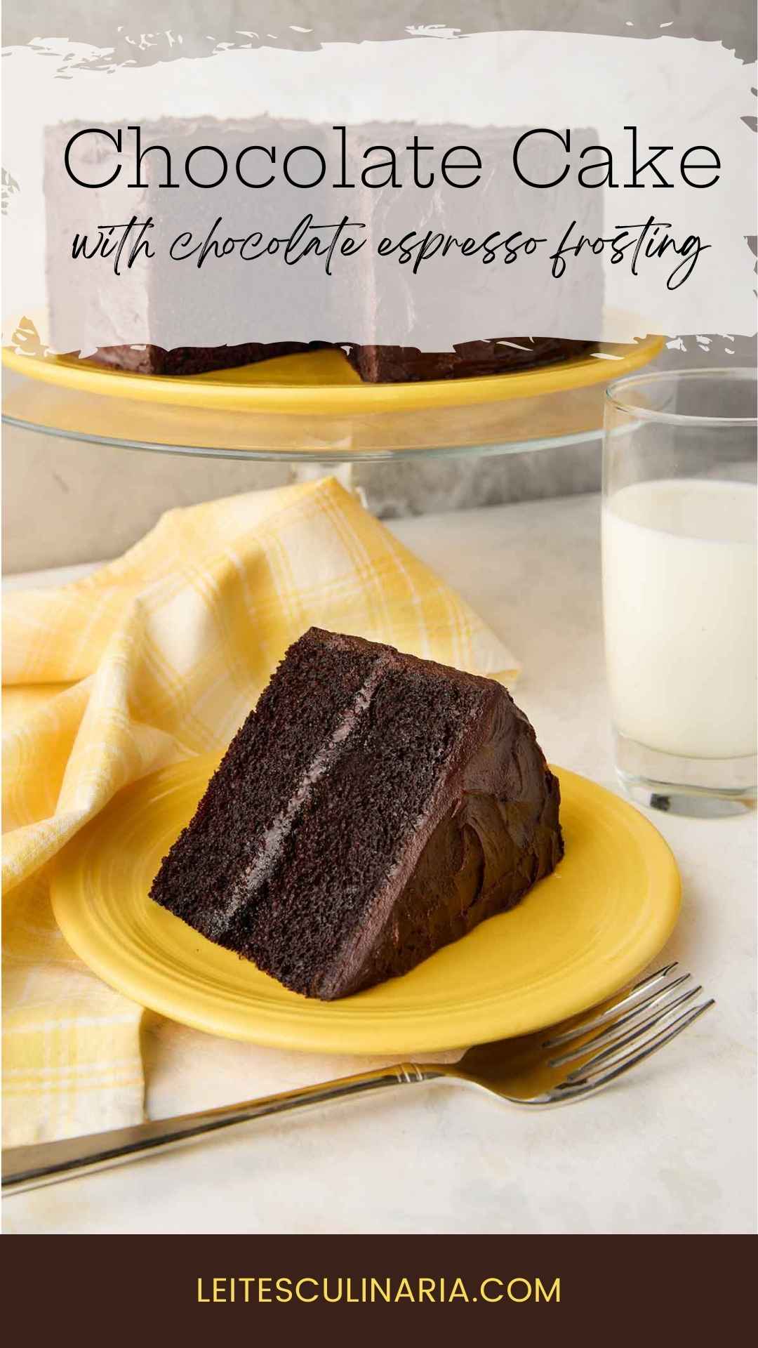 A slice of Hershey's chocolate cake with chocolate frosting on a yellow plate, with the remaining cake on a stand in the background.