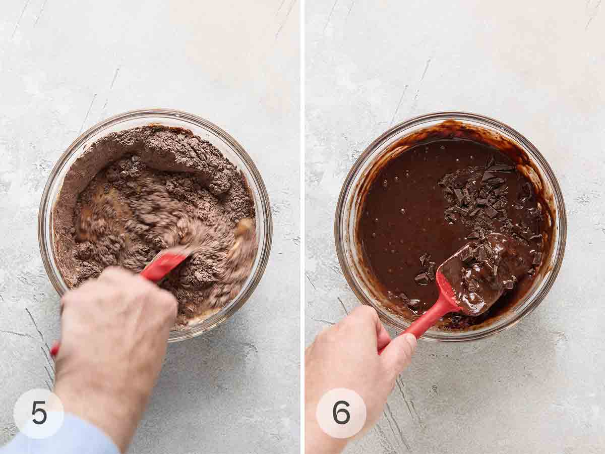 A person mixing muffin batter in a glass bowl; chocolate pieces being folded into the muffin batter.