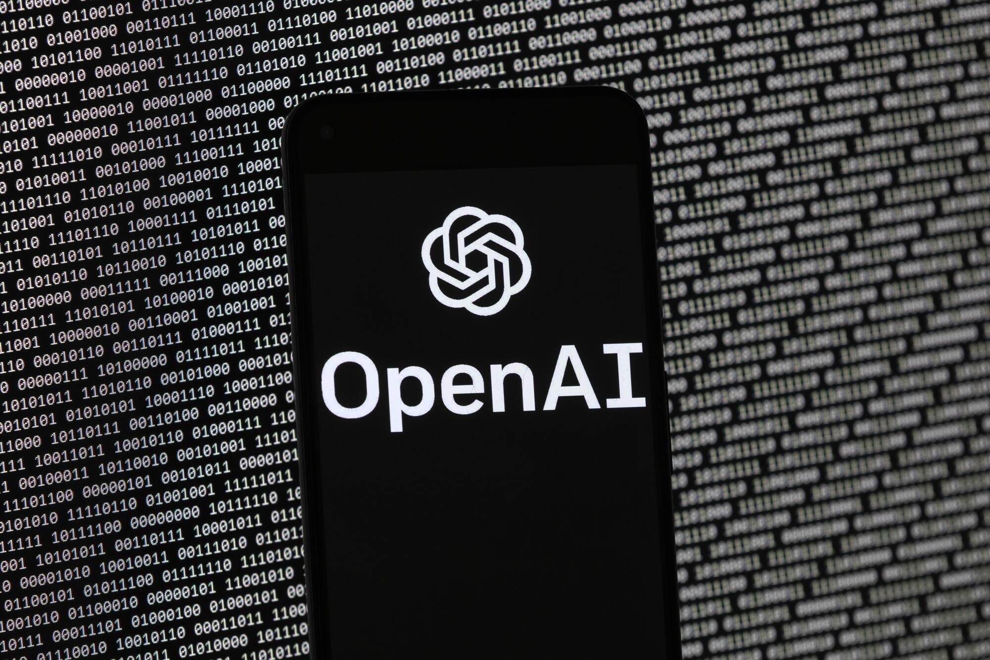 The OpenAI logo appears on a mobile phone.