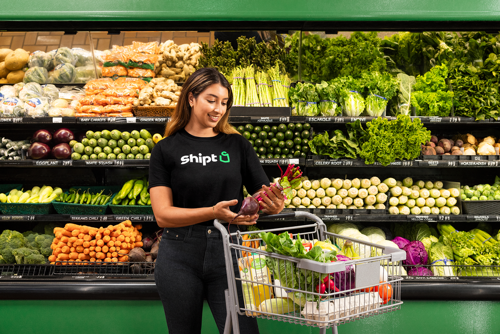 A series of glossy photographs produced by Shipt shows smiling workers wearing Shipt t-shirts happily engaged in shopping and delivering groceries.   