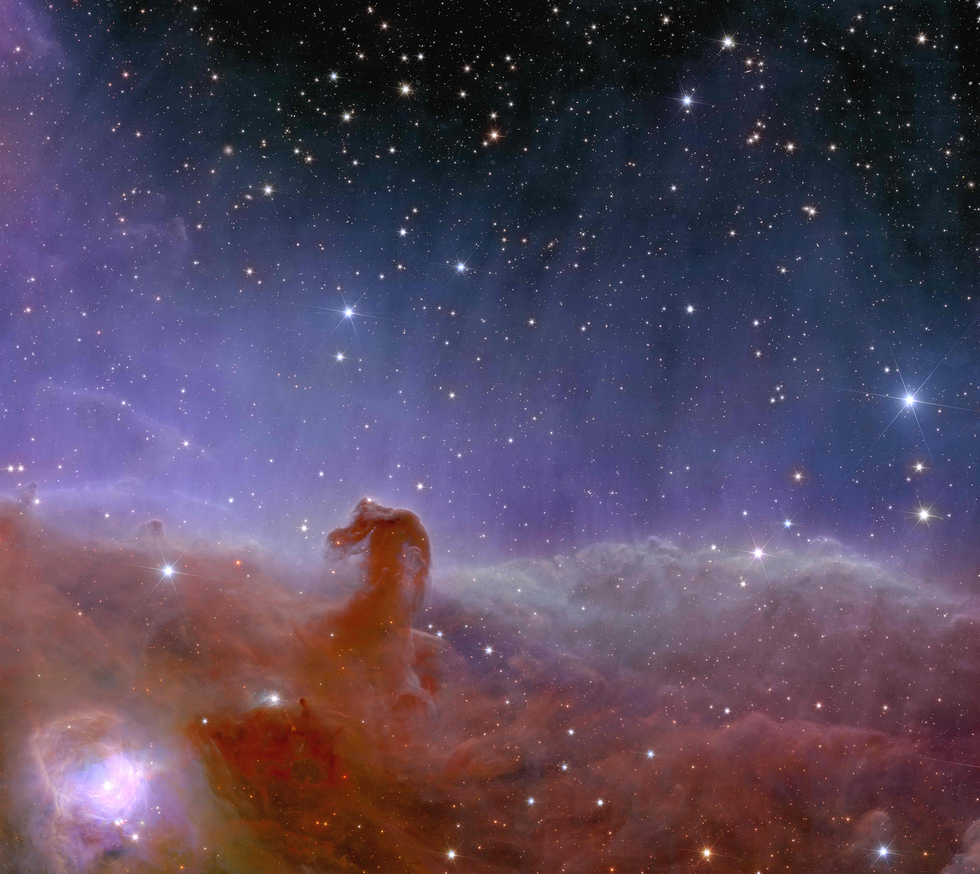 An image of the horsehead nebula with stars in the background. 