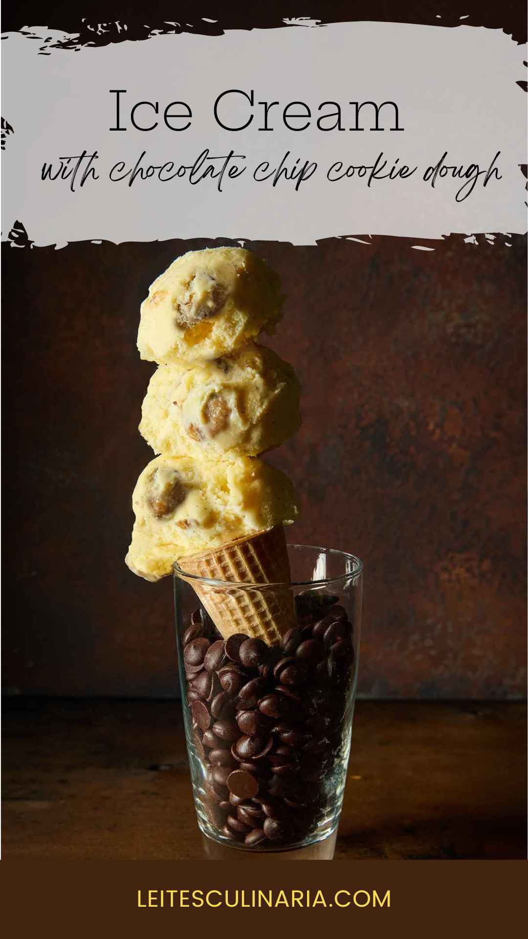 A sugar cone of chocolate chip cookie dough ice cream in a tall glass of chocolate chips.