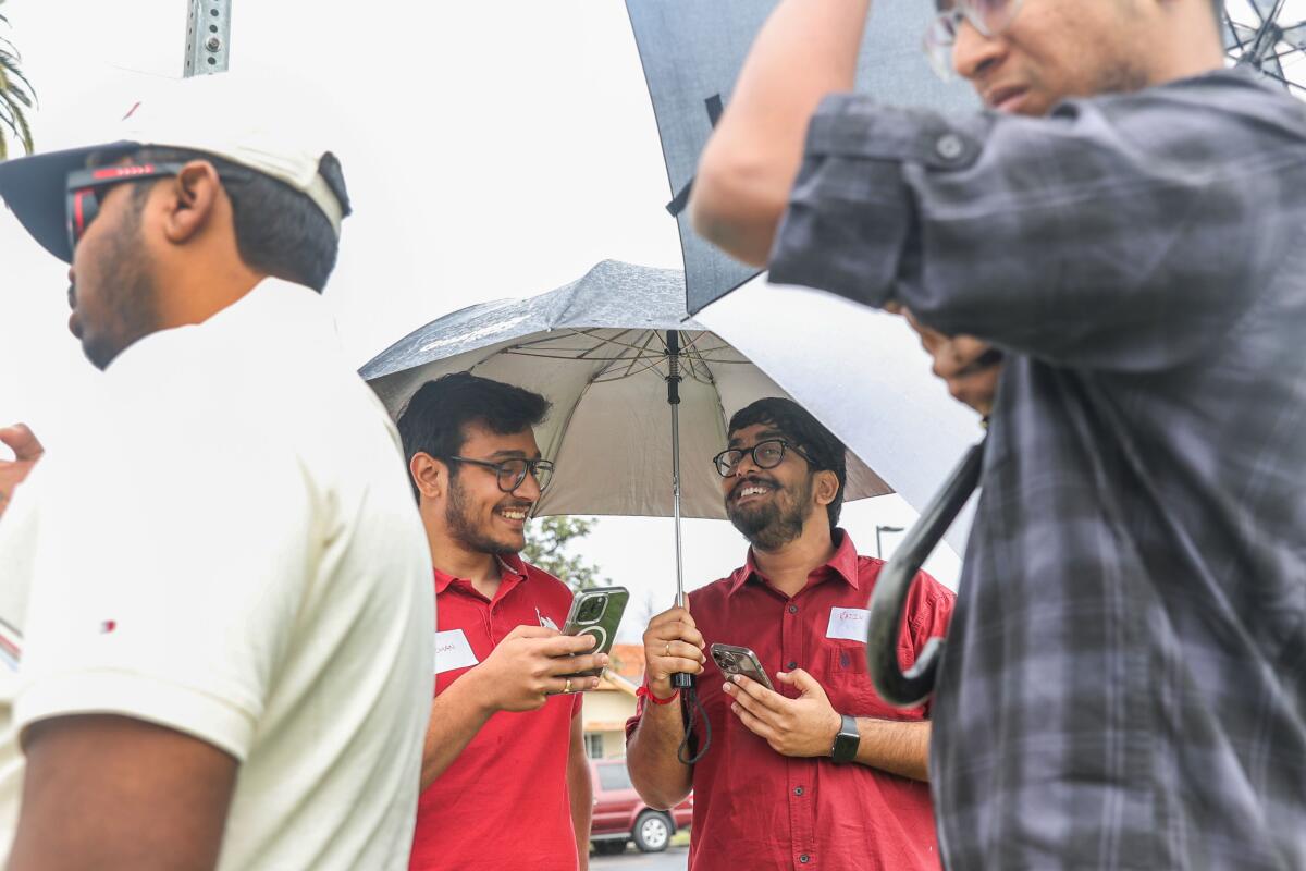 Ankit Chirra, Karthik Mohan, Rajiv Byreddy, and Praveen Venreddy outside the Mark Twain Neighborhood Library on March 6, 2024