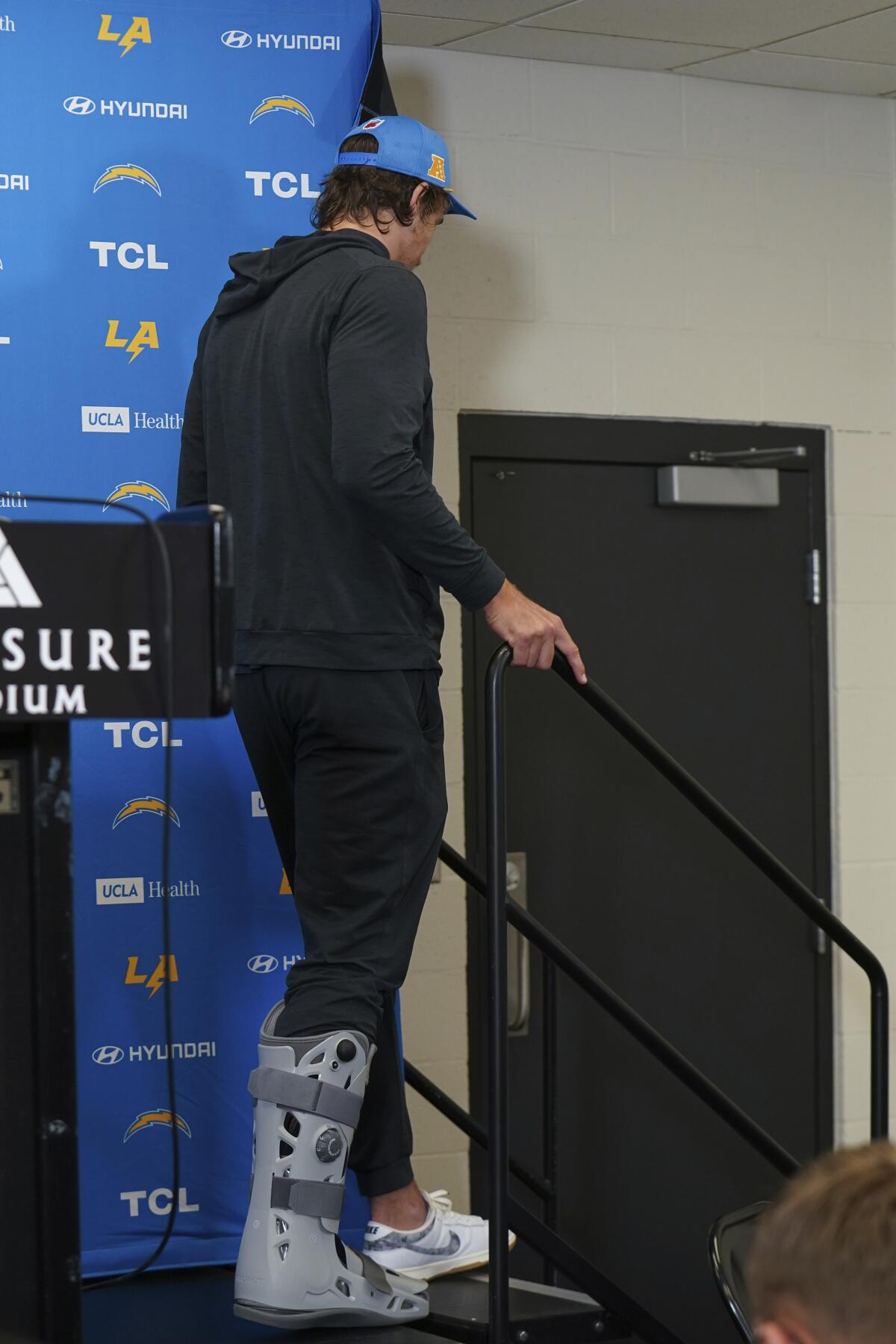 Chargers quarterback Justin Herbert wears a walking boot after a news conference following a loss to the Steelers.