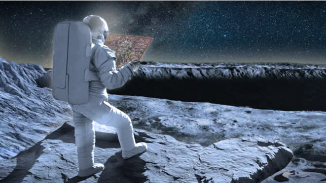  An astronaut in white spacesuit with large white backpack holds a map while standing on the moon. 