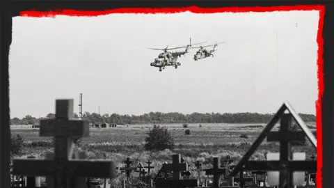 Getty Images Russian military helicopters flying near a cemetery close to a military airfield outside Taganrog, Rostov in July 2022. 