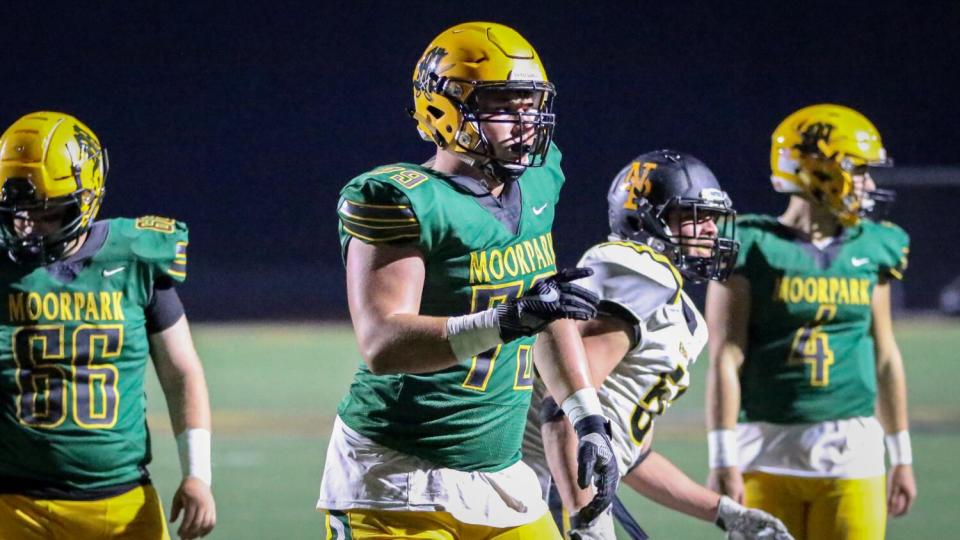 Moorpark offensive lineman Jonah Monheim, center, watches a play