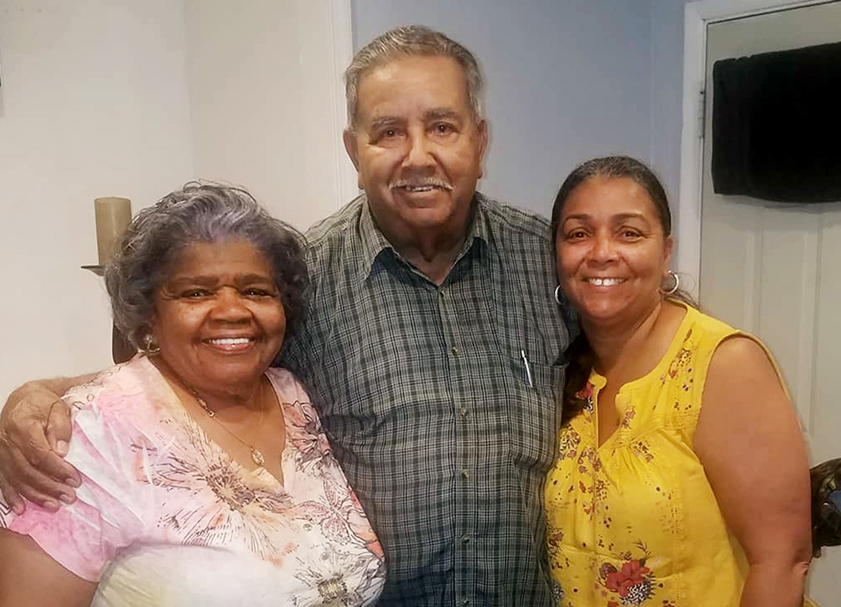 Carol Turner and her mother and father posing and smiling for a photo.