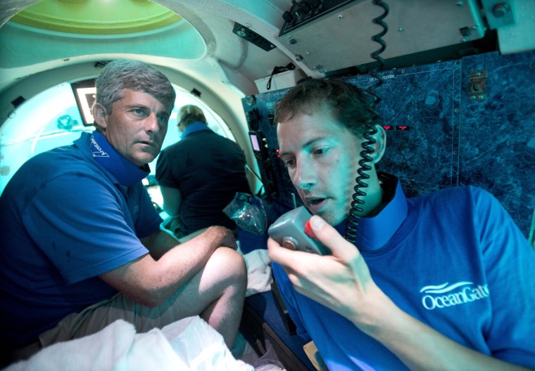 OceanGate CEO Stockton Rush, left, and pilot Randy Holt dive in the company's submersible, "Antipodes," in 2013.