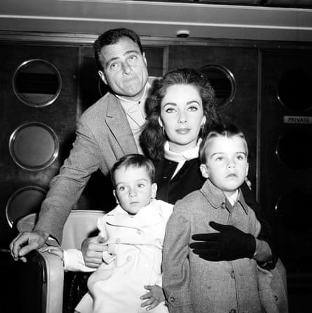 Taylor with her third husband, Mike Todd, and her sons, two-year-old Christopher Wilding (left) and four-year-old Michael Wilding, on board the Queen Elizabeth in New York in April 1957, before sailing to France for the summer.