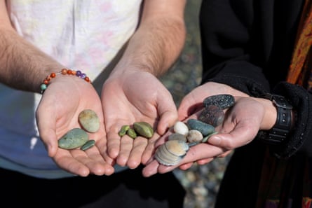 Tourist fossickers James Bergmann, of Canada, (left) and Raz Rothschild, of Israel, (right) compare precious stones at Gemstone Beach.