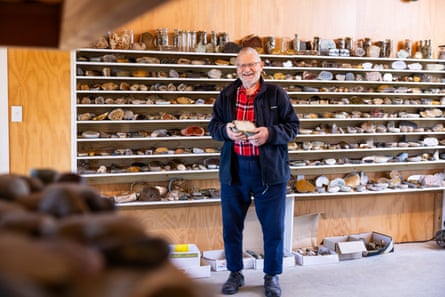 Rock collector Jack Geerlings with a favourite stone at his rock workshop and showroom in Winton, Southland, New Zealand.