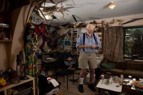 Historian Lloyd Esler holds a favourite gemstone at his home in Otatara.