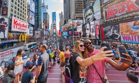 Tourists taking selfies in Times Square, New York City