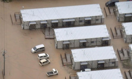 An aerial photo shows flood-hit houses after heavy rain in Wajima, Ishikawa prefecture, on Saturday 21 September.