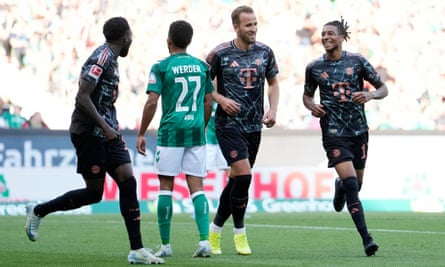 Harry Kane and Michael Olise celebrate a goal