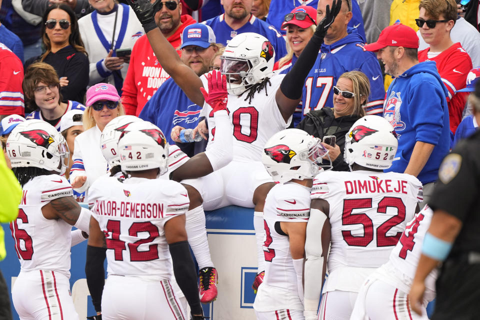 DeeJay Dallas celebrates the NFL's first return touchdown under new kickoff rules. (Gregory Fisher-Imagn Images)