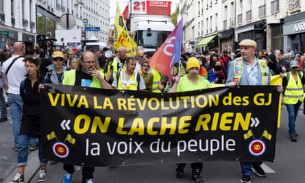 Protesters demonstrate against Michel Barnier and Emmanuel Macron in Paris