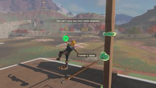 Link using the shield-jump to try and clear a spear stuck in a plank of wood