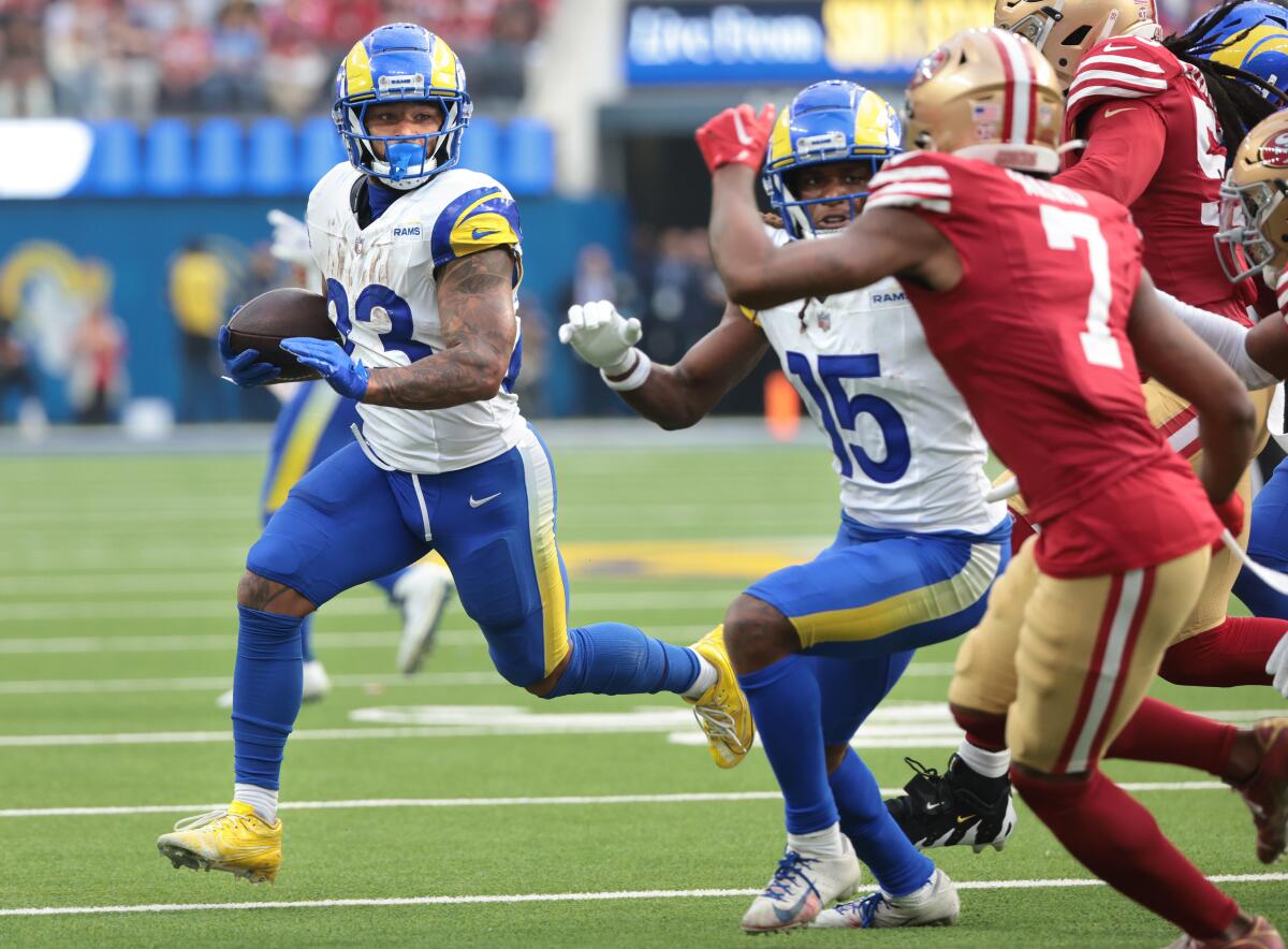 Rams running back Kyren Williams carries the ball against the San Francisco 49ers at SoFi Stadium.