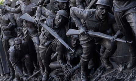 detail from bronze sculptor of soldiers with guns