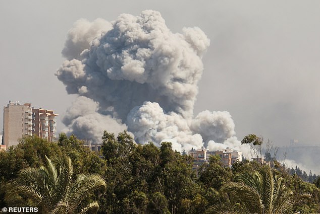 Smoke billows over southern Lebanon following Israeli strikes, amid ongoing cross-border hostilities between Hezbollah and Israeli forces, as seen from Tyre, southern Lebanon September 23, 2024