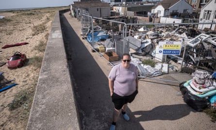 Claire Fitzpatrick next to the ruins of her house