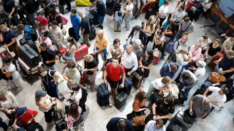 EPA A group of people waiting at Eindhoven Airport