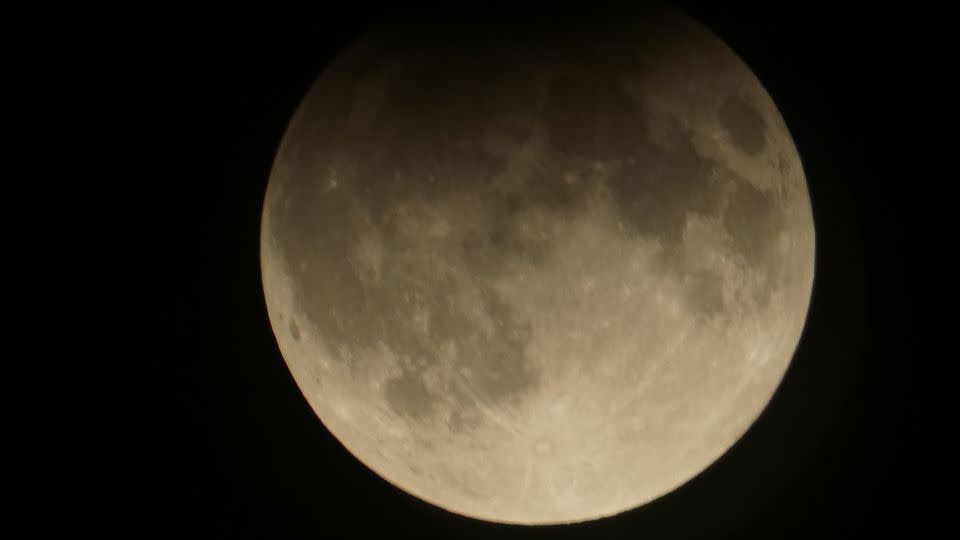 The harvest moon is seen over Toronto during a partial lunar eclipse on Wednesday. - Michael Goldstein