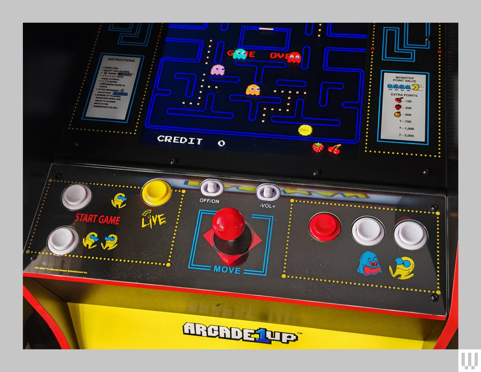 Closeup of arcade machine buttons and joystick