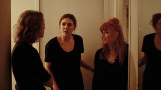 (L-R) Carrie Coon as Katie, Elizabeth Olsen as Christina and Natasha Lyonne as Rachel argue in the hallway.