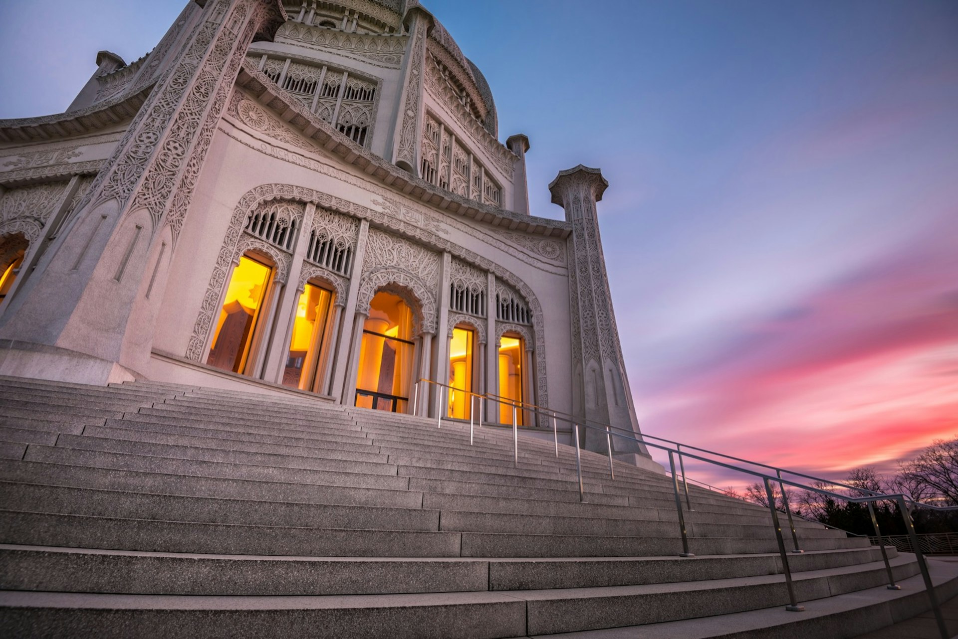 Baha’i House of Worship with a pink and blue sky in the background