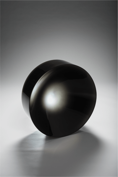 A dark black parabolic lens with a clear center.